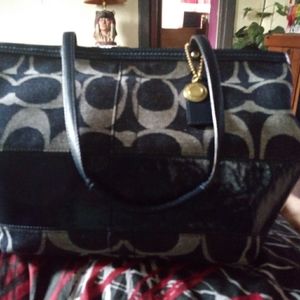 Denim Coach Legacy Stripe satchel.